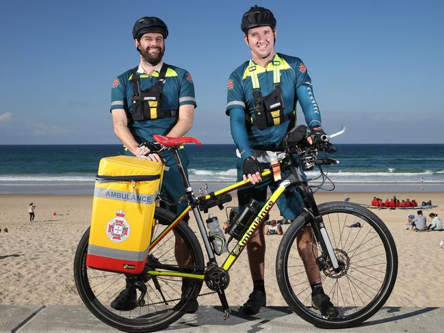 Paramedics Ian Procter and Shane McEvoy powered through the Surfers Paradise traffic on their bicycles to save a young girl from drowning today. Picture: Glenn Hampson.