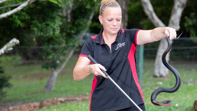 Burpengary snake catcher Leah Allen with a red-bellied black snake. Picture: Dominika Lis