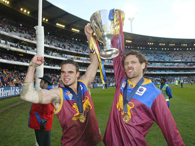 The Brisbane Lions’ Ashley McGrath, left, and Darryl White with the Premiership Cup after beating Collingwood in the 2003 Grand Final. ‘Whitey’ became an inspiration for thousands of Territory kids with his exploits on national playing fields as part of the champion Brisbane Lions AFL sides through the 1990s and early noughties. Picture: Michael Klein