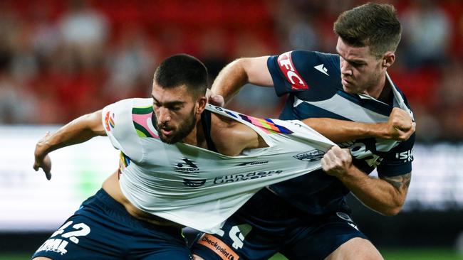 ADELAIDE, AUSTRALIA - MARCH 09:  Austin Ayoubi of Adelaide United   competes with  Connor Chapman of the Victory during the A-League Men round 20 match between Adelaide United and Melbourne Victory at Coopers Stadium, on March 09, 2024, in Adelaide, Australia. (Photo by Mark Brake/Getty Images)