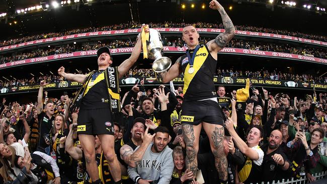 Dustin Martin and Liam Baker celebrate with the crowd. Picture: Mark Metcalfe/AFL Photos via Getty Images