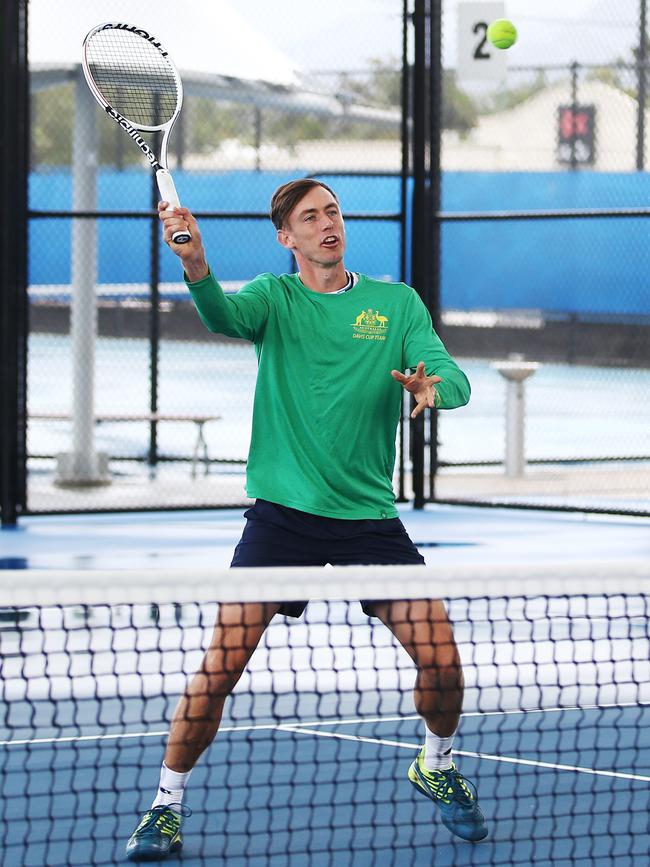 The Cairns International Tennis Centre has officially reopened with a roof now covering centre court. John Millman has a hitout on centre court with Cairns tennis juniors. PICTURE: BRENDAN RADKE