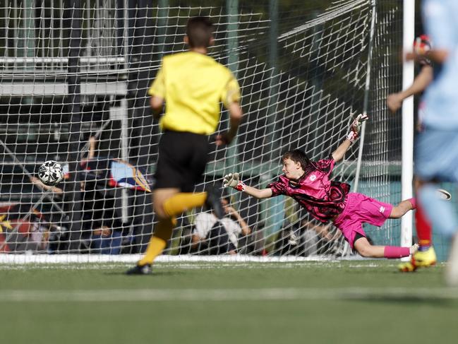 Callum Callaghan gets low, U14 Boys NAIDOC Cup at Lake Macquarie Regional Football Facility. Picture: Michael Gorton