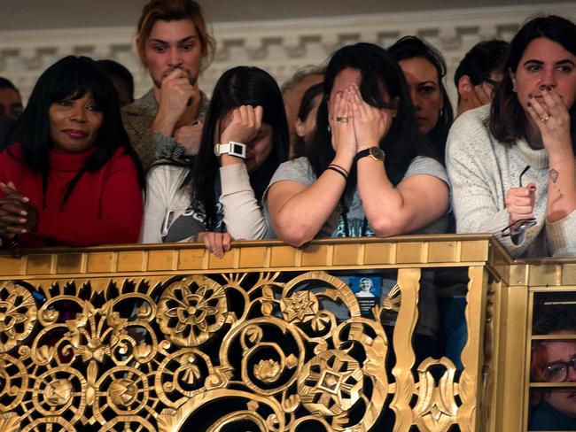 Staff and supporters react as Hillary Clinton speaks after her defeat in the presidential election. Picture: AFP PHOTO / Brendan Smialowski