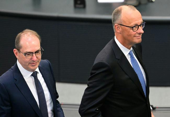 Germany's new Interior Minister Alexander Dobrindt (L), pictured with Chancellor Friedrich Merz (R), said Germany's new government has ordered border officers to reject undocumented migrants