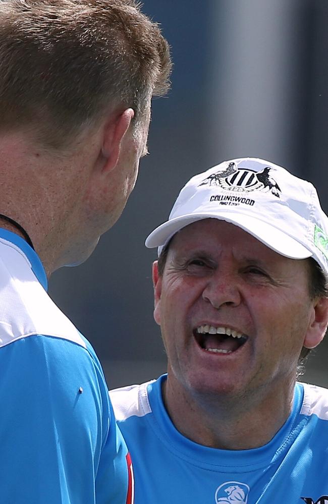 Bradley Gotch shares a laugh with Pies coach Nathan Buckley.