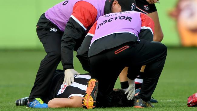 St Kilda doctors rush to help Dylan Roberton after he collapsed at GMBHA Stadium.