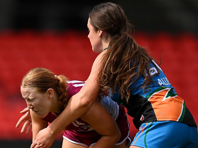 Tara Harrington of Queensland is tackled during the AFL National Championships (Photo by Albert Perez/AFL Photos via Getty Images)