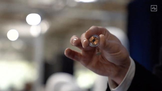 This video grab made from the online Neuralink livestream shows the Neuralink disk implant held by Elon Musk during the presentation on August 28, 2020. Picture: Neuralink/AFP