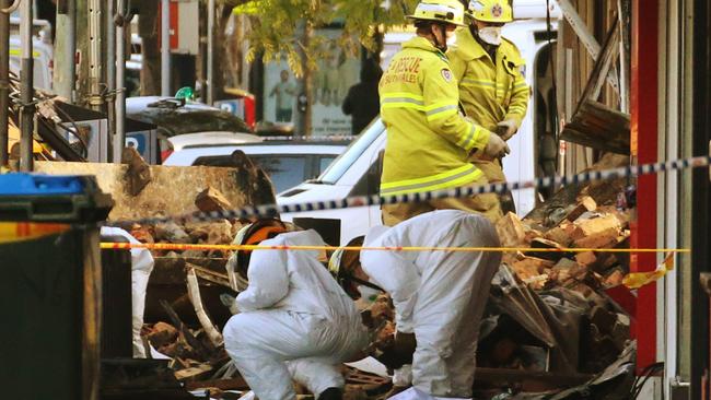 Forensic and NSW Fire and Rescue work at the scene of the explosion in September 2014.