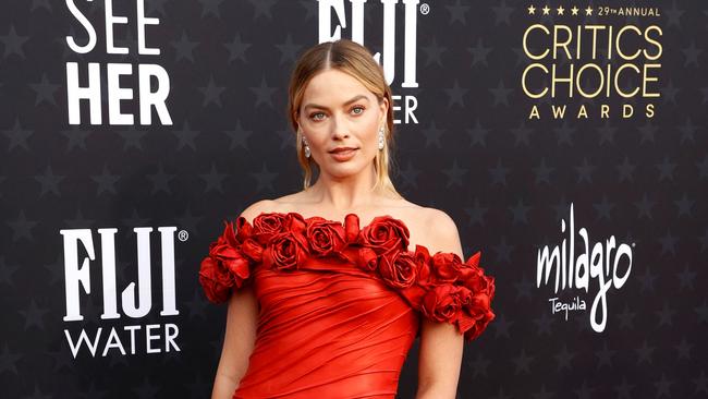 (FILES) Australian actress Margot Robbie arrives for the 29th Annual Critics Choice Awards at the Barker Hangar in Santa Monica, California on January 14, 2024. Nominations for this year's Oscars will be unveiled on January 23, 2024, with the "Barbenheimer" juggernaut expected to roll on to the climax of Hollywood's awards season with multiple chances at glory. After a combined $2.4 billion global box office take, "Barbie" and "Oppenheimer" — two films linked only by their simultaneous release last July — are seen as locks for a suite of nods for the 96th Academy Awards, which take place on March 10. (Photo by Michael TRAN / AFP)