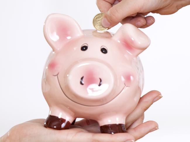 MONEYSAVERHQ .. KOCH COLUMN .. photo of a piggy bank and hands