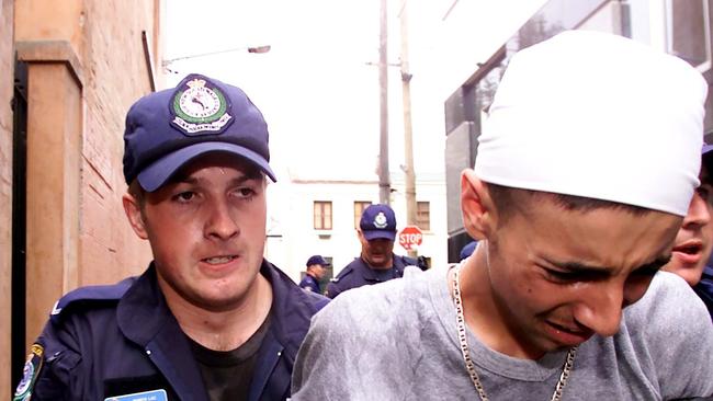 <b>Suspected IS member Delil Alexander is arrested in 2003 after an anti-Gulf War protest in Sydney. Picture: </b>Scott Hornby