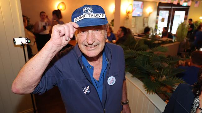 Steve Weimgarth customises his hat with a “Dump Trump” message. Picture: Rohan Kelly