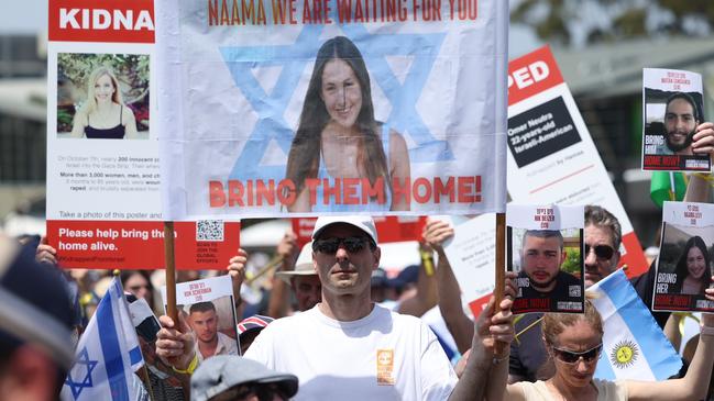 Zack and Atara Shachar also attended the rally holding a sign which showed the face of their 19 year - old niece, Naama Levy who was captured in Gaza. Picture: Dylan Robinson