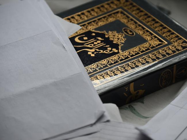 A book and documents ... seen inside the home of shooting suspect Syed Farook. Picture: AFP