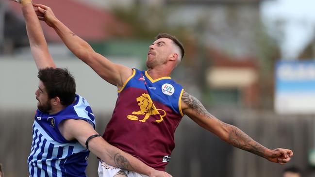 South Morang’s Aaron Lazaric contests the ruck. Picture: Stuart Milligan