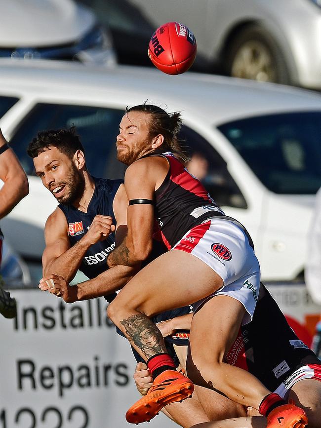 West's Kenny Karpany tackles South's Matt Rankine. Picture: Tom Huntley.