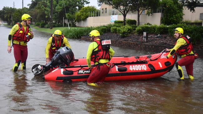 Heavy rain lashes Townsville causing flash flooding. Fire and Rescue Swiftwater Rescue Firefighters search for missing woman  opposite Castletown and back to the Causeway. Picture: Evan Morgan