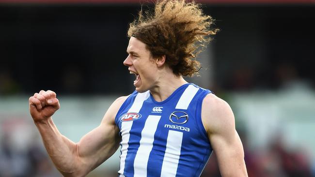 Ben Brown kicked four goals to inspire the North Melbourne Kangaroos to victory over the Melbourne Demons at Blundstone Arena.