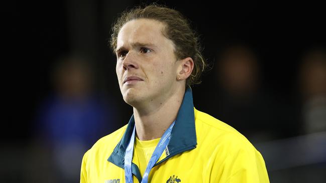 MELBOURNE, AUSTRALIA - DECEMBER 16: Silver medallist Isaac Cooper of Australia shows his emotion during the medal ceremony for the MenÃ¢â¬â¢s 50m Backstroke Final on day four of the 2022 FINA World Short Course Swimming Championships at Melbourne Sports and Aquatic Centre on December 16, 2022 in Melbourne, Australia. (Photo by Daniel Pockett/Getty Images)