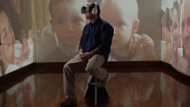 Jason Larke watches his son's birth from 4000km away on a Samsung Galaxy VR headset.