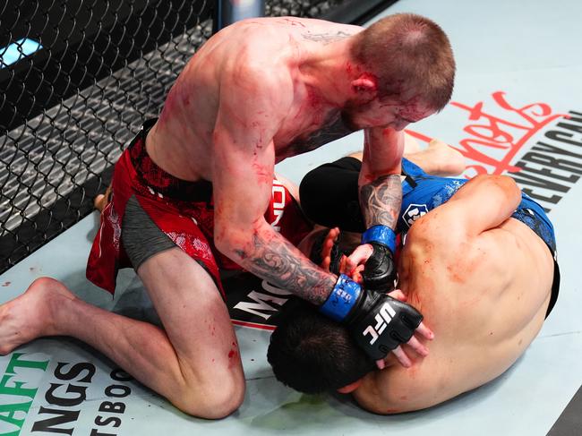 LAS VEGAS, NEVADA - MAY 18: (L-R) Tom Nolan of Australia punches Victor Martinez in a lightweight fight during the UFC Fight Night event at UFC APEX on May 18, 2024 in Las Vegas, Nevada.  (Photo by Chris Unger/Zuffa LLC via Getty Images)