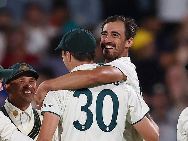 ADELAIDE, AUSTRALIA - DECEMBER 07: Mitchell Starc of Australia celebrates with teammates after bowling Shubman Gill of India during day two of the Men's Test Match series between Australia and India at Adelaide Oval on December 07, 2024 in Adelaide, Australia. (Photo by Paul Kane/Getty Images)