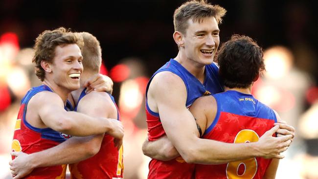 Well they may celebrate! Brisbane’s Ryan Lester, Nick Robertson, Harris Andrews and Rohan Bewick show their delight after a terrific win over Essendon. Picture: Adam Trafford (AFL Media/Getty Images)