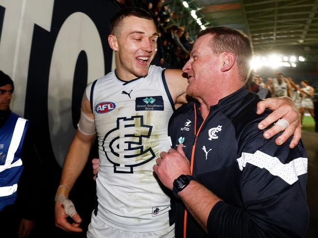 Patrick Cripps and Michael Voss walk off the ground together. Picture: Michael Willson/AFL Photos via Getty Images.