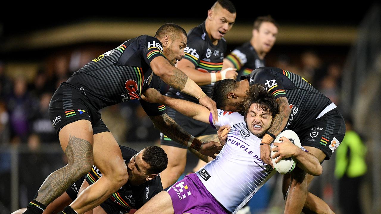 Brandon Smith of the Storm is tackled by Frank Winterstein (left) Reagan Campbell-Gillard and Sione Katoa of the Panthers (right) during the Round 3 NRL match between the Penrith Panthers and Melbourne Storm at Carrington Park, in Bathurst, Saturday, March 30, 2019. (AAP Image/Dan Himbrechts) NO ARCHIVING, EDITORIAL USE ONLY