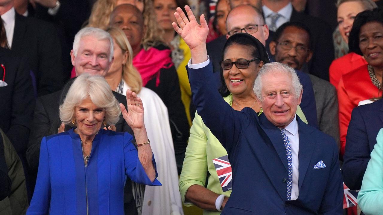 Britain's King Charles III and Britain's Queen Camilla wave as they arrive to attend the Coronation concert at Windsor Castle. Picture: AFP