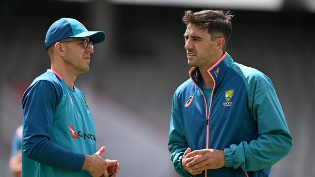 (L-R) Todd Murphy and Australia captain Pat Cummins speak during a nets session at Emirates Old Trafford. Picture: Getty Images