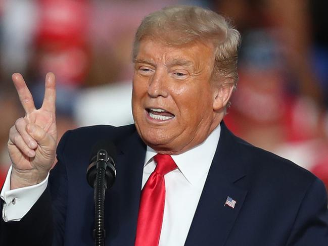 SANFORD, FLORIDA - OCTOBER 12: President Donald Trump speaks during his campaign event at the Orlando Sanford International Airport on October 12, 2020 in Sanford, Florida. Trump was holding his first campaign rally since his coronavirus diagnosis as he continues to campaign against Democratic presidential candidate Joe Biden.   Joe Raedle/Getty Images/AFP == FOR NEWSPAPERS, INTERNET, TELCOS & TELEVISION USE ONLY ==