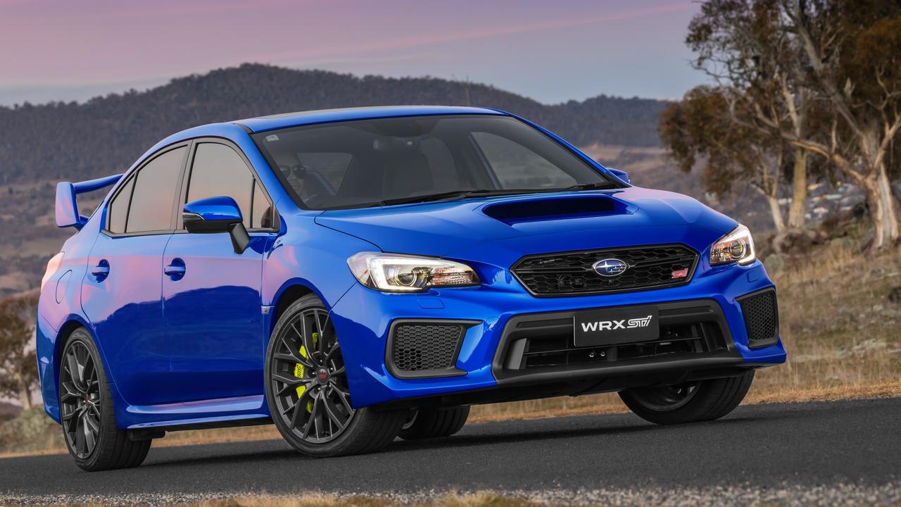 Updated STI sedans have bright yellow brakes.