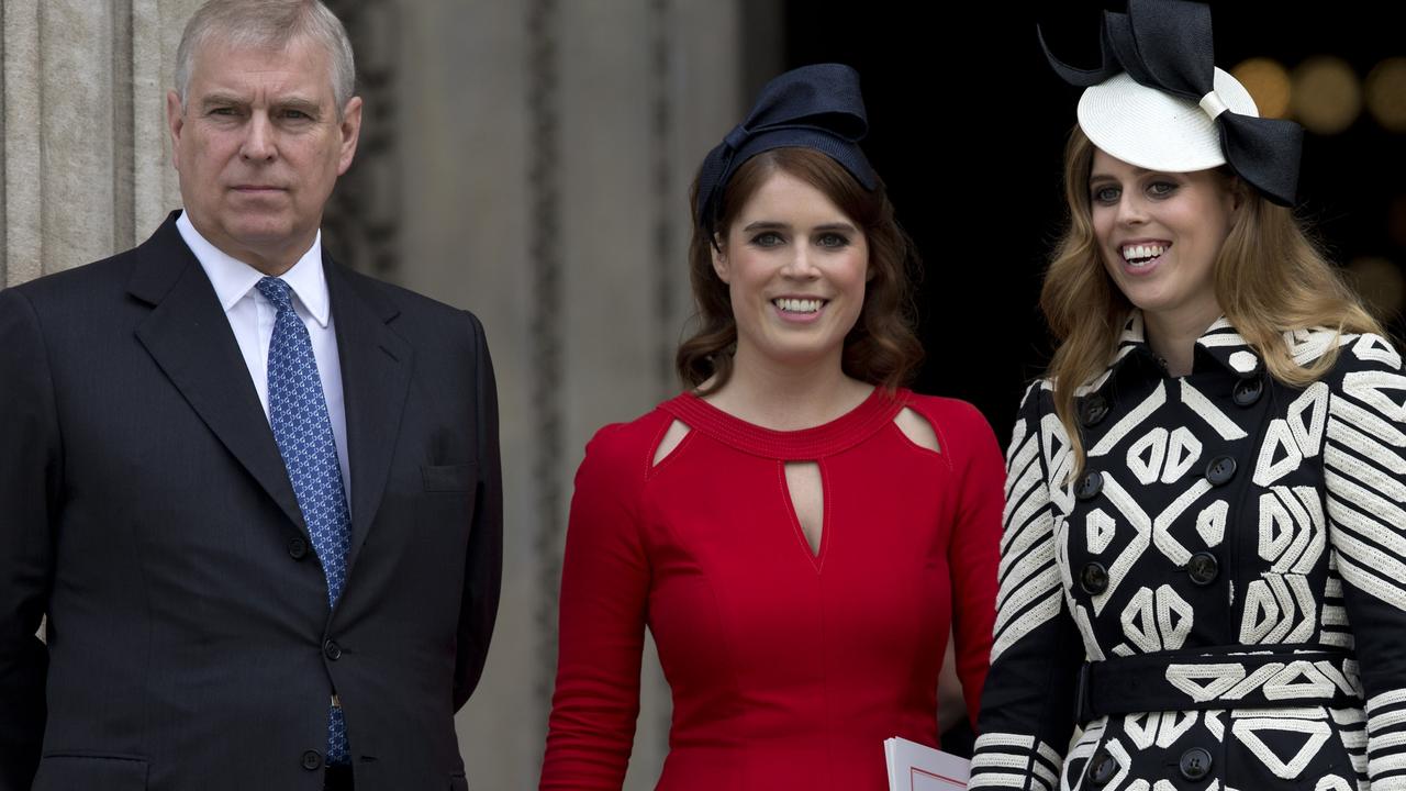 Prince Andrew with Princess Eugenie and Princess Beatrice. Picture: Justin Tallis/AFP