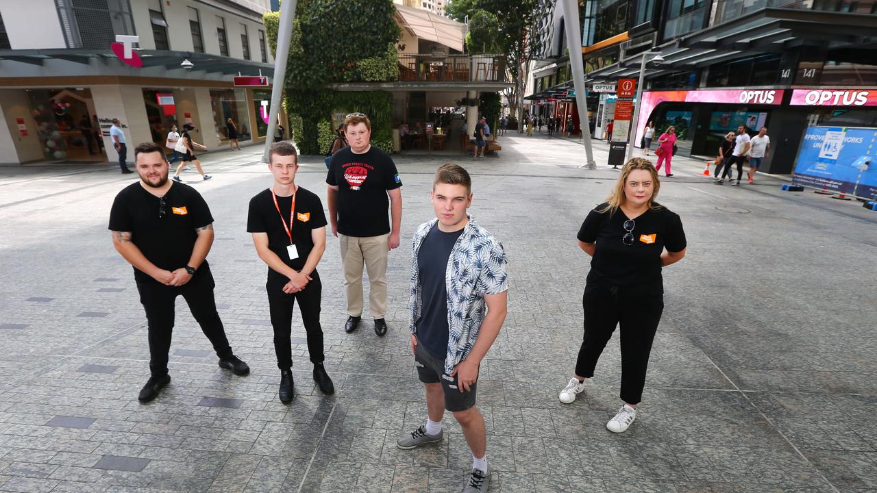 Alex Knott with members of the Young Workers Hub in Brisbane. Picture: David Clark