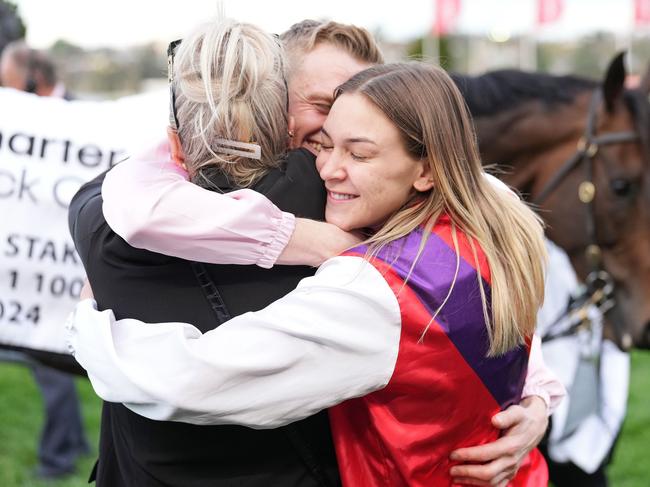 Ethan Brown is embraced by Celine Gaudray after Mornington Glory won the Charter Keck Cramer Moir Stakes at Moonee Valley Racecourse on September 07, 2024 in Moonee Ponds, Australia. (Photo by Scott Barbour/Racing Photos via Getty Images)