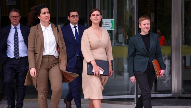 Brittany Higgins (centre) leaves the ACT Magistrates Court with members of her legal team in Canberra on October 14. Picture: AFP