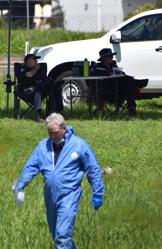 Police in a vacant area off the Bruce Highway at Paget about 100m from The Park caravan park where a 25-year-old man's body was allegedly found about 3am on Tuesday, December 14, 2021. Picture: Matthew Forrest