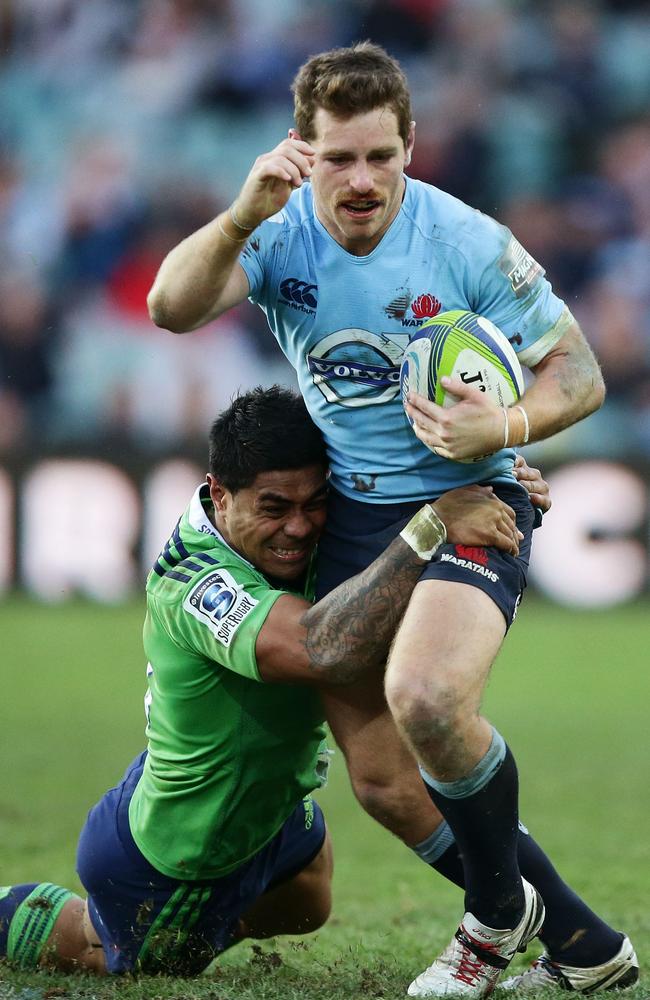 Bernard Foley tries to beat the tackle of Malakai Fekitoa last weekend.