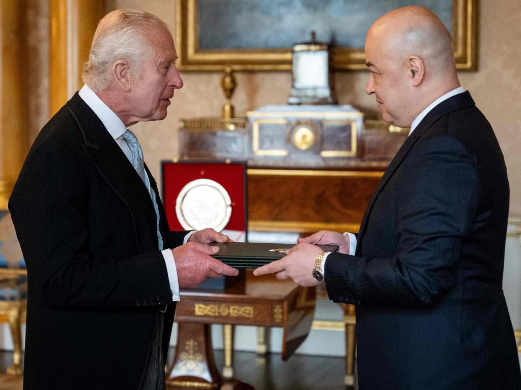 Uzbekistan's Ambassador to the UK Ravshan Usmanov (R) presents his credentials to King Charles III during a private audience at Buckingham Palace. Picture: AFP