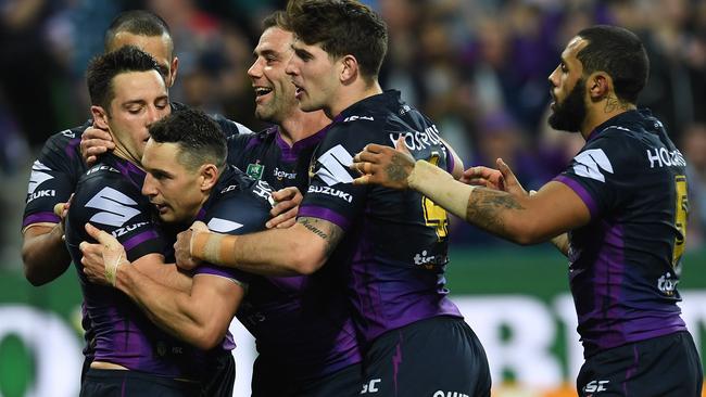 Storm players react after Billy Slater scored try.