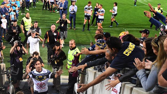 Fans pay their respects to Johnathan Thurston as he walks off the field for the last time. Picture: AAP/Dave Hunt