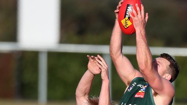 A Hampden player takes a mark over a Ballarat player. Picture Yuri Kouzmin