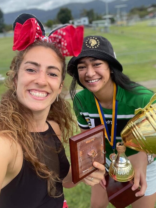 Wanderers' Evelien Rosier and Becka Marsters with the broken FNQ Rugby Women's trophy during the club’s celebrations. Picture: Facebook