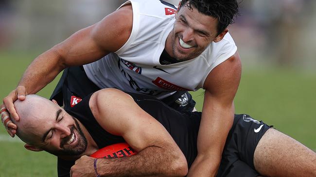 Club champions Scott Pendlebury and Steele Sidebottom enjoy the lighter side of the session. Picture: Michael Klein