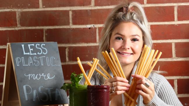 PASS THE PASTA: Lucie Pike at The Seller Door in Brighton with pasta straws, which are being used as an enviro-friendly alternative to plastic. Picture: TAIT SCHMAAL