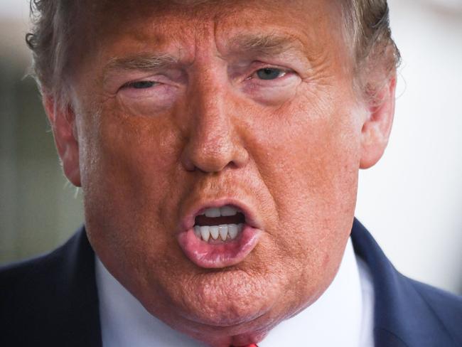 (FILES) In this file photo former US President Donald Trump speaks to the press before departing the White House  on June 20, 2020 in Washington, DC, for a campaign rally in Tulsa, Oklahoma. - Former US president Donald Trump moved on August 4, 2021 to block the Treasury from handing over years of his tax records to a congressional committee, which some believe could expose abuse of tax laws. In a Washington court filing Trump's lawyers objected to a Justice Department order last week that the Treasury, after stalling for years, needed to provide the House Ways and Means Committee with six years of records that Trump has long refused to make public. (Photo by Eric BARADAT / AFP)