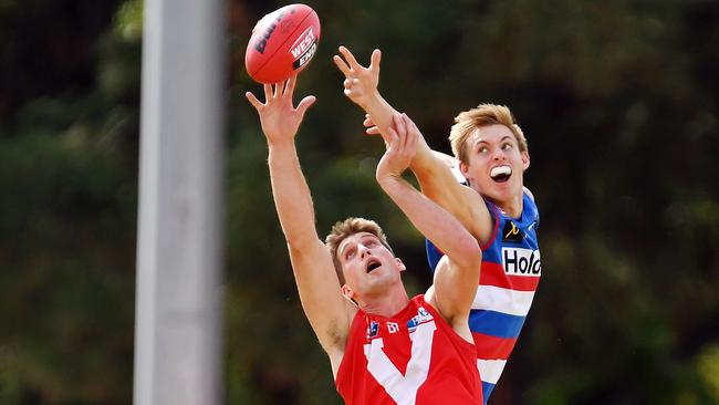 19/04/19 - SANFL: North Adelaide v Central District at Prospect Oval.  Central's Jonathon Marsh and North's Jack Blair compete in the ruck. Picture: Tom Huntley